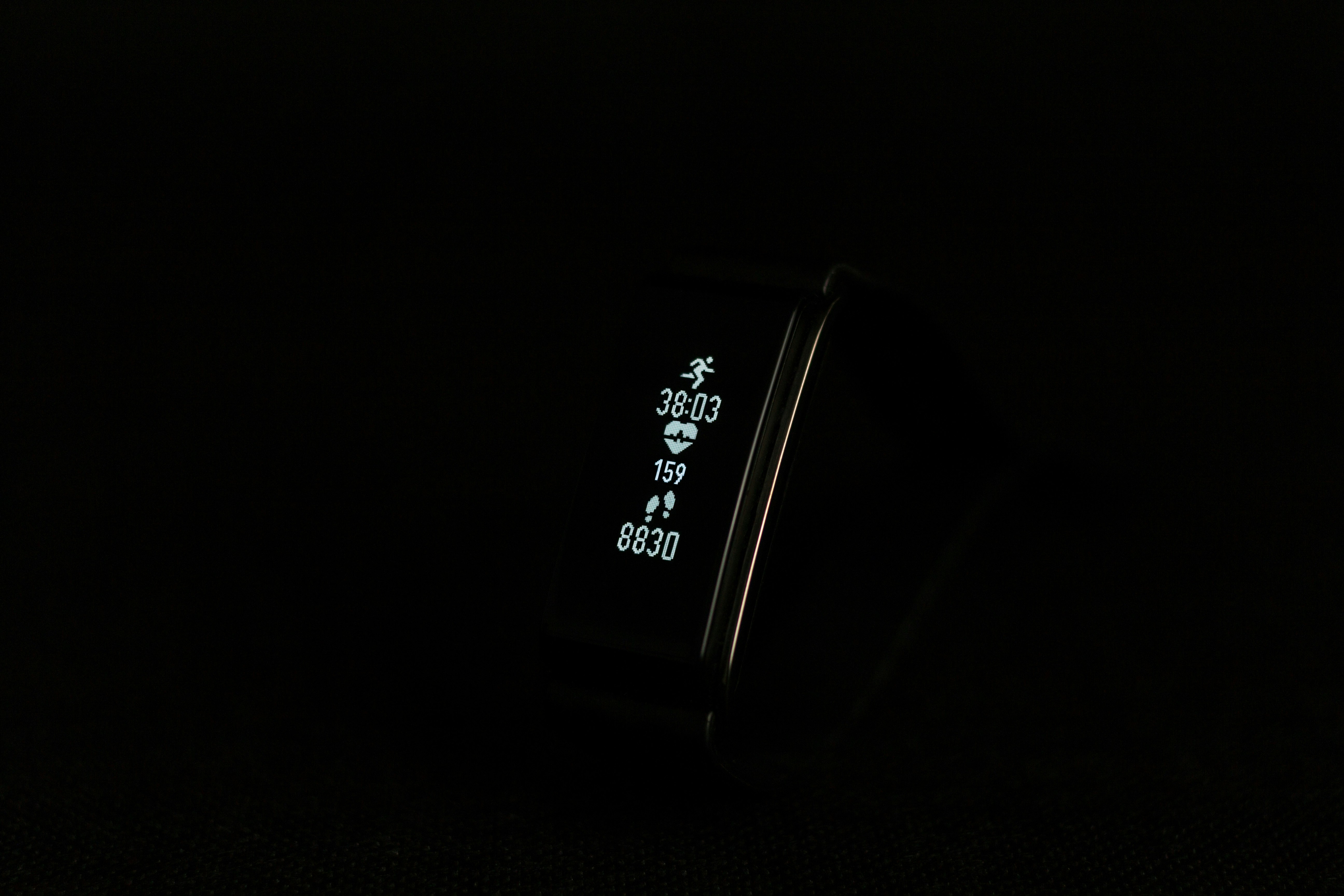 close-up photo of black fitness band powered on